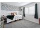 Cozy bedroom with stylish wallpaper accent wall, soft textures, and natural light at 25106 E 1St Ave, Aurora, CO 80018