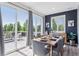 Bright dining area with large glass doors leading to an outdoor living space at 25106 E 1St Ave, Aurora, CO 80018