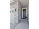 Inviting front entrance with stylish stone accents and a charming wreath, creates a warm welcome to this beautiful home at 25106 E 1St Ave, Aurora, CO 80018