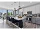 Bright, modern kitchen with stainless steel appliances, a spacious island, and elegant pendant lighting is perfect for cooking at 25106 E 1St Ave, Aurora, CO 80018