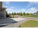 Street view of a well-manicured neighborhood with mature trees and green lawns at 25106 E 1St Ave, Aurora, CO 80018