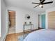 Bedroom featuring an ensuite bathroom and chic décor with a blue accent door at 1050 N Lafayette St # 408, Denver, CO 80218