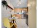 Bright kitchen nook with stylish wallpaper, a round table, and modern appliances at 1050 N Lafayette St # 408, Denver, CO 80218