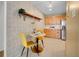 Bright kitchen nook with stylish wallpaper, a round table, and modern appliances at 1050 N Lafayette St # 408, Denver, CO 80218