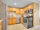 Modern kitchen features stainless steel appliances and light wood cabinetry at 1050 N Lafayette St # 408, Denver, CO 80218