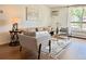 Comfortable living room with a modern neutral color palette and lots of natural light at 1050 N Lafayette St # 408, Denver, CO 80218