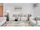 Cozy living room features stylish decor, comfortable seating, and a chic glass coffee table at 1050 N Lafayette St # 408, Denver, CO 80218