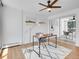 Bright office space with hardwood floors, large window, ceiling fan, and contemporary decor with mirror at 1050 N Lafayette St # 408, Denver, CO 80218