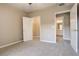 Bright bedroom with carpet flooring and access to a closet at 17497 Nature Walk Trl # 101, Parker, CO 80134