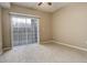 Bedroom with sliding door to balcony and carpet flooring at 17497 Nature Walk Trl # 101, Parker, CO 80134