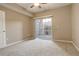 Bedroom with patio access and carpet flooring at 17497 Nature Walk Trl # 101, Parker, CO 80134