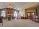 Relaxing community room with fireplace, comfortable seating, and bar area at 17497 Nature Walk Trl # 101, Parker, CO 80134