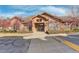 Community clubhouse with inviting landscaping and plenty of parking at 17497 Nature Walk Trl # 101, Parker, CO 80134