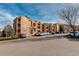 Exterior view of the apartment building with parking at 17497 Nature Walk Trl # 101, Parker, CO 80134