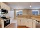 Open kitchen with granite countertops and island at 17497 Nature Walk Trl # 101, Parker, CO 80134