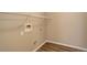 Well-lit laundry room with washer and dryer hookups, shelving, and vinyl flooring at 17497 Nature Walk Trl # 101, Parker, CO 80134