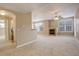 Open living room with a fireplace and carpet at 17497 Nature Walk Trl # 101, Parker, CO 80134