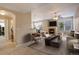 Bright living room features a fireplace and access to the kitchen at 17497 Nature Walk Trl # 101, Parker, CO 80134