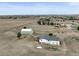 Aerial view featuring home, separate garage, tank, and extensive open land at 2845 Cherry Way, Parker, CO 80138