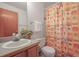 Bathroom features a single sink vanity and a shower with patterned curtain at 2845 Cherry Way, Parker, CO 80138