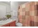 Cozy bathroom with tub, shower, gray vanity with white sink, toilet and decorative shower curtain at 2845 Cherry Way, Parker, CO 80138