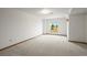 Bright bedroom offers neutral carpet, white walls, and natural light from the window at 2845 Cherry Way, Parker, CO 80138