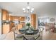 Bright dining area and kitchen with granite counters, light wood cabinets, and stainless appliances at 2845 Cherry Way, Parker, CO 80138