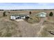Expansive acreage featuring a charming single-story home with a large garage and a sizable storage building at 2845 Cherry Way, Parker, CO 80138
