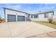 Charming home featuring a large, attached two-car garage and convenient front driveway at 2845 Cherry Way, Parker, CO 80138