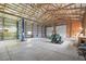 Large garage with a car lift, tractor, and mower at 2845 Cherry Way, Parker, CO 80138