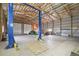 Spacious garage interior with a vehicle lift and ample room for machinery at 2845 Cherry Way, Parker, CO 80138