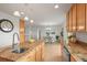 Well-lit kitchen featuring granite counters, stainless appliances, and an open flow into the dining area at 2845 Cherry Way, Parker, CO 80138