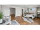 Spacious main bedroom featuring hardwood floors, a walk-in closet, and a sitting area with bright light at 2845 Cherry Way, Parker, CO 80138