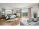 Serene main bedroom with hardwood floors, neutral tones, balcony access, and ample natural light at 2845 Cherry Way, Parker, CO 80138