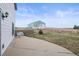 Back patio with seating area, overlooking the lawn and detached garage at 2845 Cherry Way, Parker, CO 80138