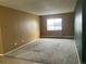 Inviting living room with neutral carpet and a window providing natural light at 707 W 96Th Ave # 9, Thornton, CO 80260