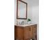 This bathroom features a granite counter, a wooden vanity, a plant, a mirror, and other amenities at 5155 W 68Th Ave # 5, Westminster, CO 80030