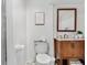 Simple bathroom with a wooden vanity and a shower with sliding glass doors at 5155 W 68Th Ave # 5, Westminster, CO 80030