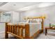 Cozy bedroom featuring a log-style bed frame and neutral decor, offering a rustic and inviting space at 5155 W 68Th Ave # 5, Westminster, CO 80030