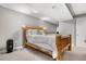 Bright bedroom featuring a log bed frame, with carpeted floors and neutral color, offering a cozy retreat at 5155 W 68Th Ave # 5, Westminster, CO 80030