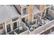 Exterior view of townhomes with stone and snow-covered rooftops, showcasing the architecture and outdoor living space at 5155 W 68Th Ave # 5, Westminster, CO 80030
