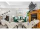 Comfortable living room featuring a fireplace, television, and stylish decor at 5155 W 68Th Ave # 5, Westminster, CO 80030