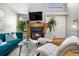 Cozy living room featuring a fireplace, modern furniture, and plants at 5155 W 68Th Ave # 5, Westminster, CO 80030