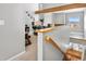 Upstairs loft area with desk, home office, and view of the entryway at 5155 W 68Th Ave # 5, Westminster, CO 80030