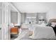 Bright main bedroom featuring a cozy sitting area, a window and neutral decor at 5155 W 68Th Ave # 5, Westminster, CO 80030