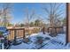 Back deck with snowy ground and seating area at 5416 S Gray St, Littleton, CO 80123