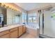 Bathroom with double sinks, garden tub, and shower at 5416 S Gray St, Littleton, CO 80123