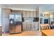 Kitchen boasts stainless steel refrigerator and ample cabinet space at 5416 S Gray St, Littleton, CO 80123
