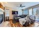 Living room with hardwood floors, fireplace, and sliding glass doors at 5416 S Gray St, Littleton, CO 80123