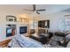 Living room features a fireplace, hardwood floors and comfortable seating at 5416 S Gray St, Littleton, CO 80123